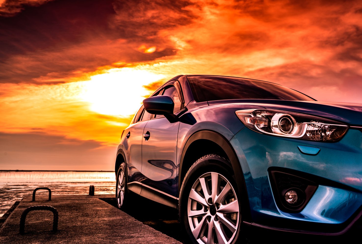 Blue Compact SUV Car at the Beach 